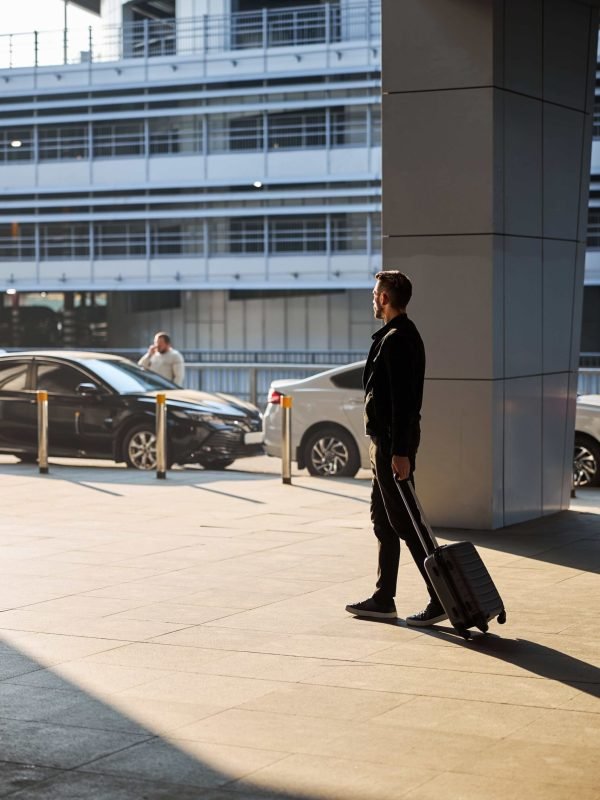 man-in-casual-clothes-walking-with-his-luggage-2025-03-09-11-39-51-utc